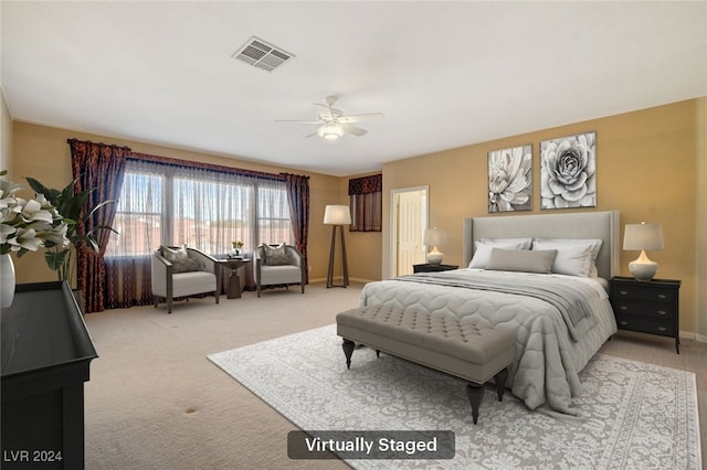 carpeted bedroom with ceiling fan