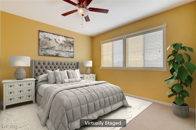 carpeted bedroom featuring ceiling fan