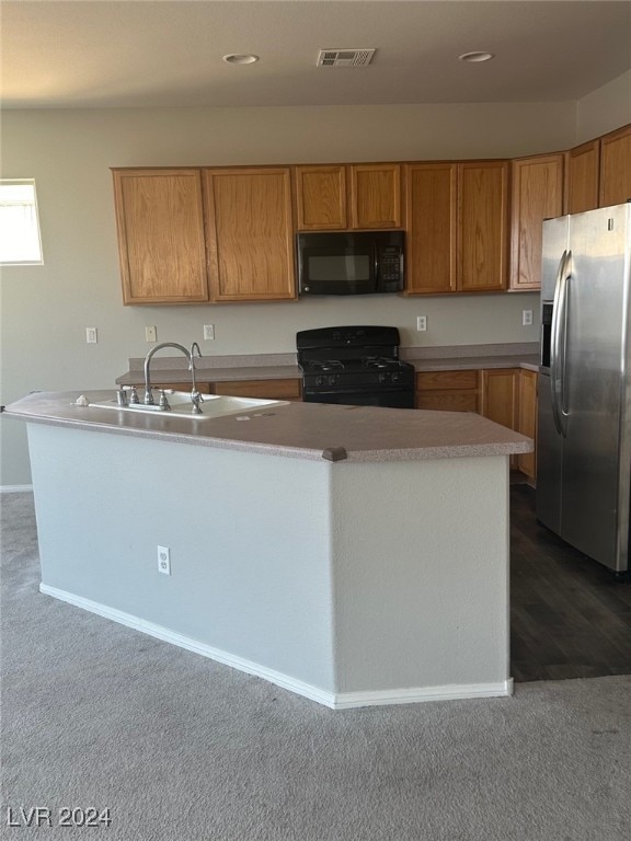 kitchen featuring black appliances, dark colored carpet, and sink