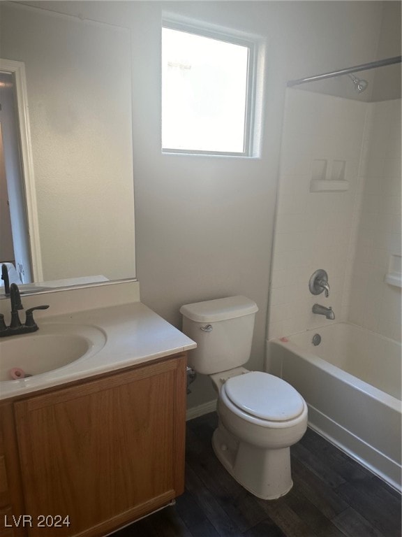 full bathroom featuring shower / tub combination, hardwood / wood-style flooring, vanity, and toilet