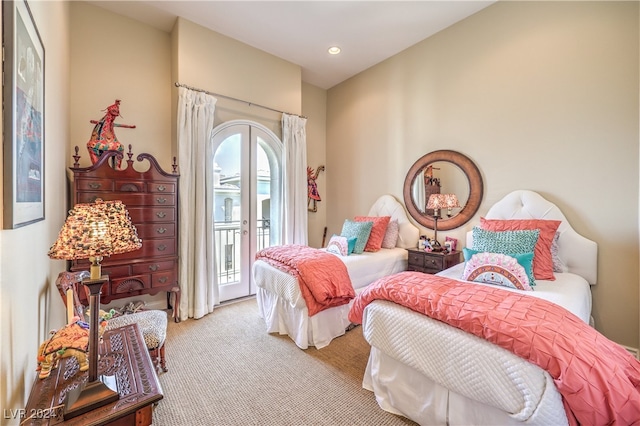 carpeted bedroom featuring access to exterior