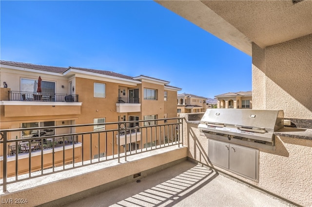 balcony featuring area for grilling and a grill