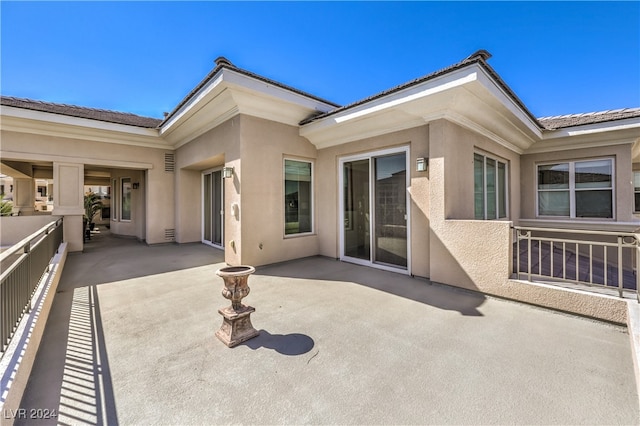 back of house featuring a patio