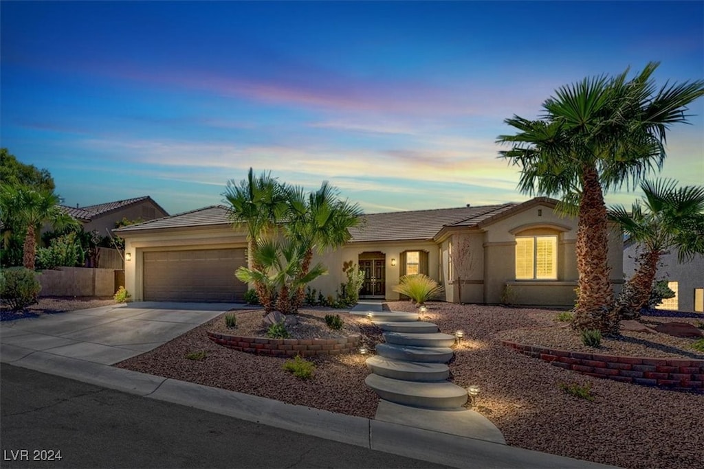 single story home with a garage