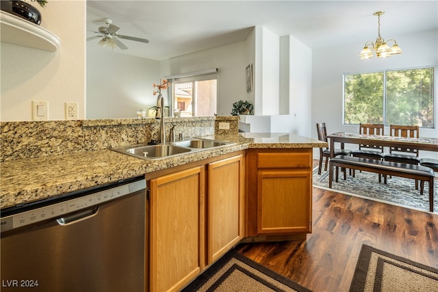 kitchen featuring dark wood-type flooring, sink, dishwasher, kitchen peninsula, and pendant lighting