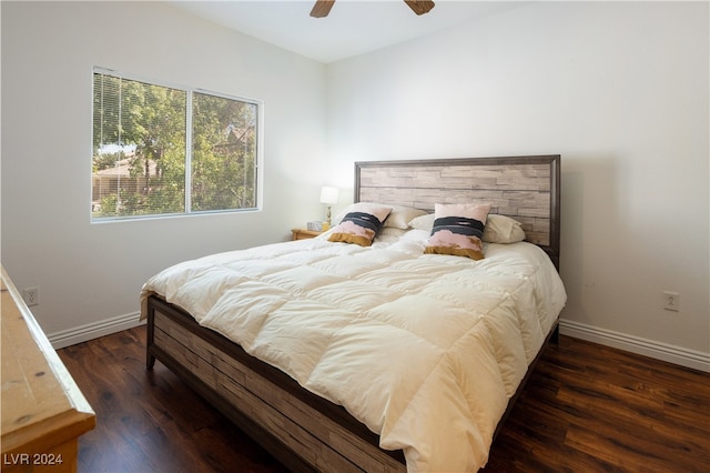 bedroom with dark wood-type flooring and ceiling fan