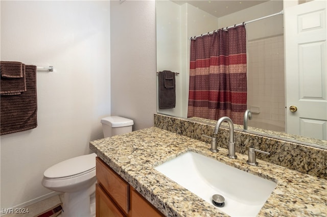 bathroom with vanity, toilet, and a shower with curtain