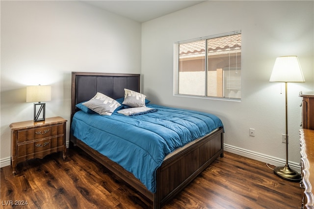 bedroom featuring dark wood-type flooring