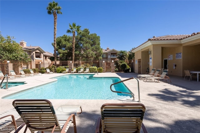 view of swimming pool featuring a patio area