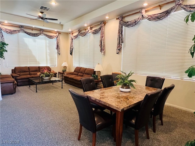 dining room with carpet and ceiling fan