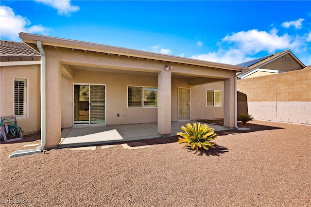 back of property featuring a patio