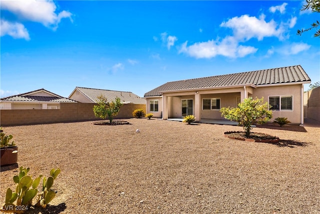 back of property featuring a patio