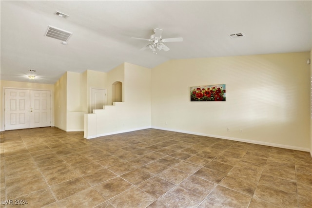 empty room featuring vaulted ceiling and ceiling fan