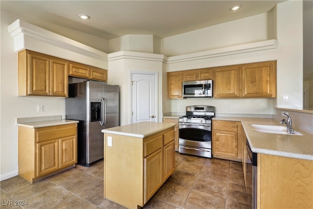 kitchen with a center island, sink, and stainless steel appliances