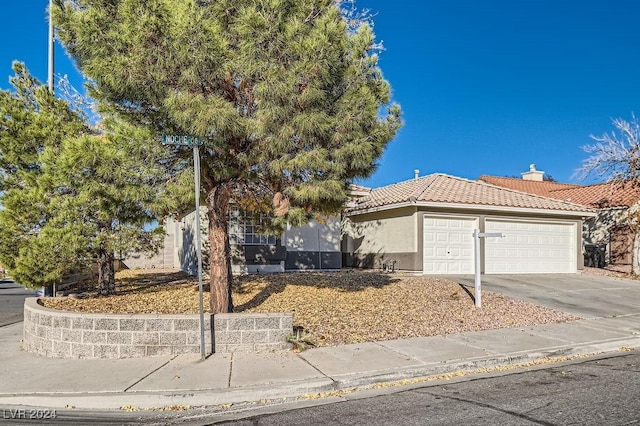 view of front of property with a garage