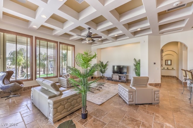 living room featuring ceiling fan, beam ceiling, and coffered ceiling