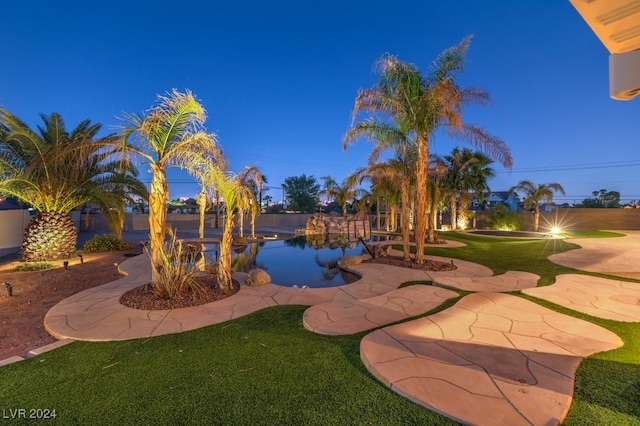 yard at dusk with a patio