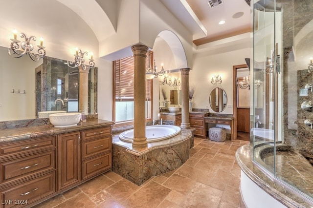 bathroom with plus walk in shower, vanity, decorative columns, and high vaulted ceiling