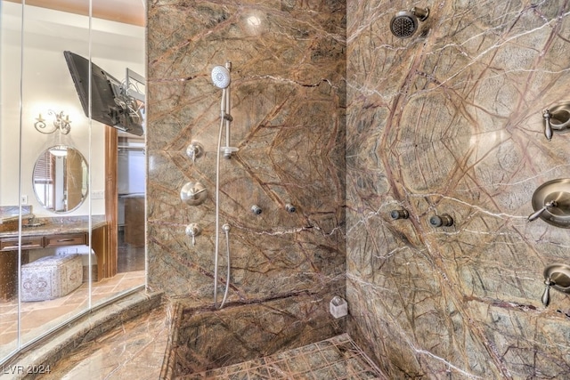 bathroom with a tile shower