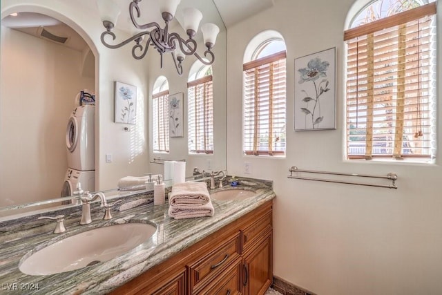 bathroom with vanity, plenty of natural light, and a notable chandelier