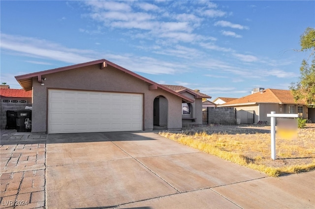 single story home featuring a garage