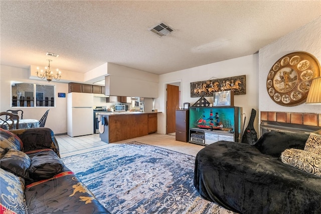 living room featuring a notable chandelier and a textured ceiling