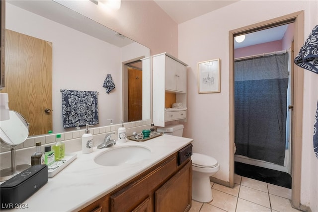 bathroom featuring walk in shower, vanity, tile patterned flooring, and toilet