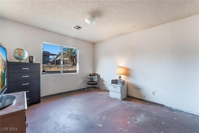 misc room with a textured ceiling