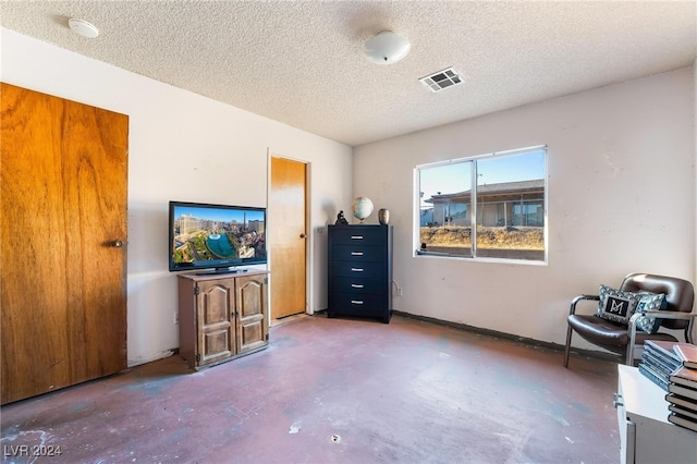 interior space with a textured ceiling