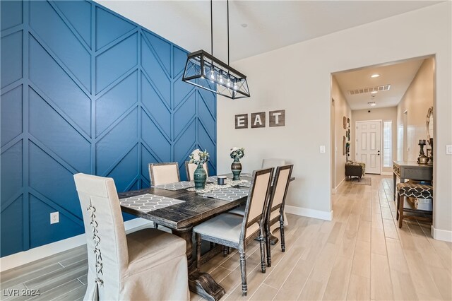 dining area featuring light wood-type flooring