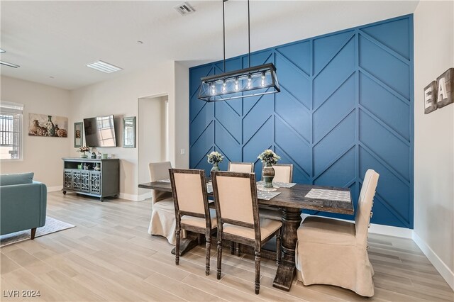 dining space with light hardwood / wood-style floors