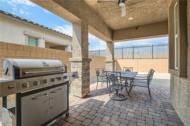 view of patio / terrace featuring ceiling fan and a grill