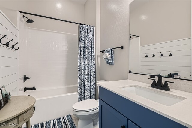 full bathroom with shower / tub combo, vanity, toilet, and tile patterned floors