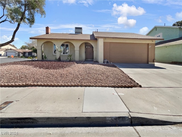 single story home featuring a garage