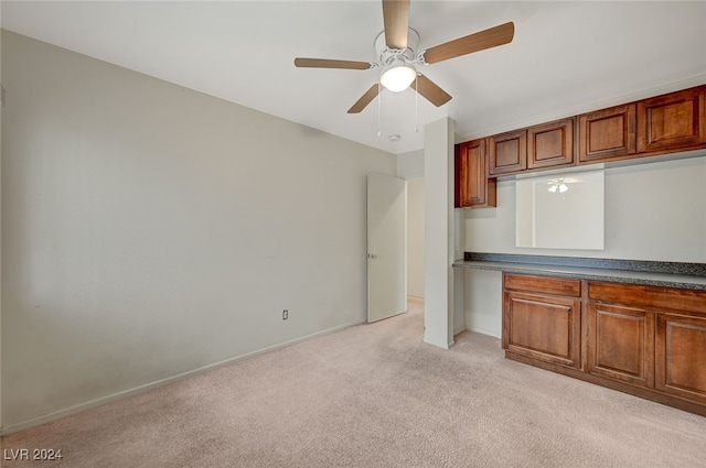 kitchen with light carpet and ceiling fan