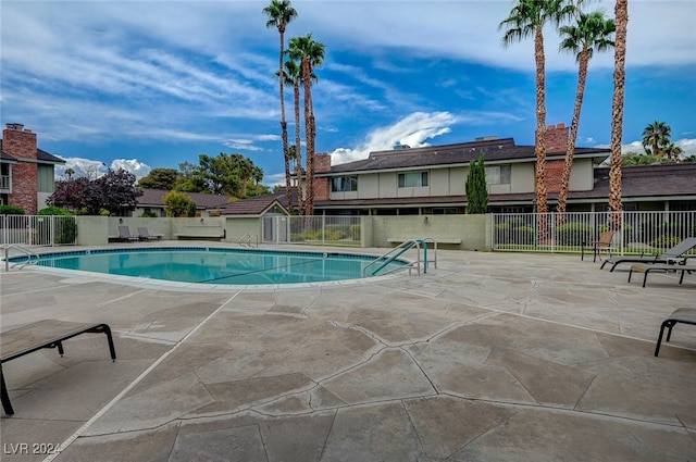 view of swimming pool with a patio