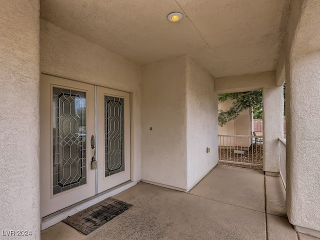 entrance to property featuring french doors