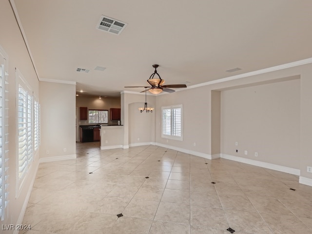 unfurnished living room with ceiling fan with notable chandelier, ornamental molding, and a healthy amount of sunlight