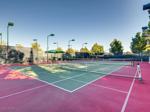 view of sport court featuring basketball hoop