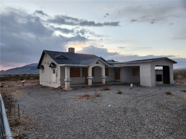 view of front of property featuring a carport and a mountain view