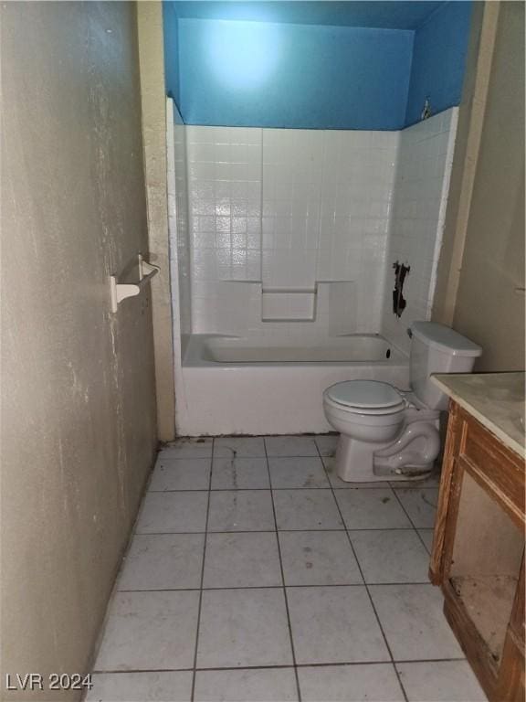 bathroom featuring toilet, tile patterned flooring, shower / tub combination, and vanity