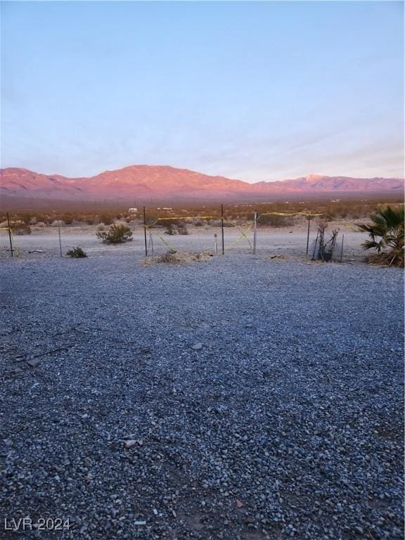 yard at dusk with a mountain view