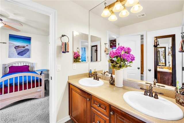 bathroom with ceiling fan and vanity