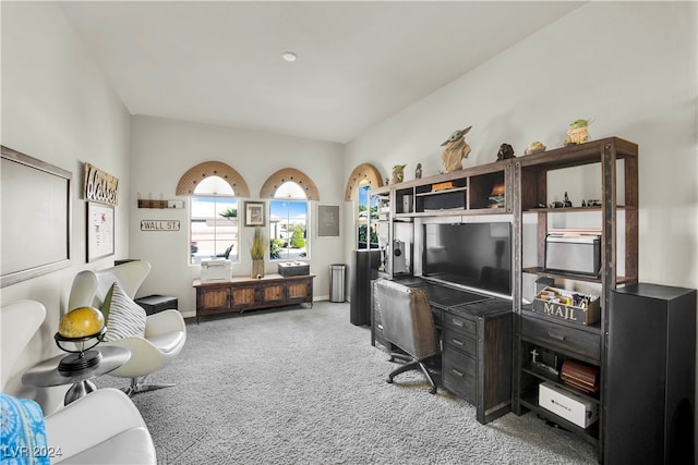 home office with carpet floors and vaulted ceiling