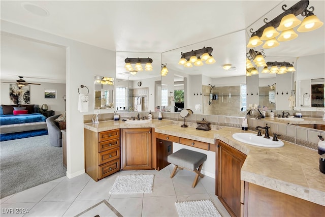 bathroom featuring walk in shower, vanity, ceiling fan, and tile patterned floors