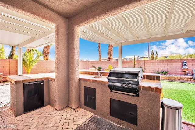 127 Birch Ridge Ave, Las Vegas, NV 89183 - fenced backyard featuring exterior kitchen and a pergola
