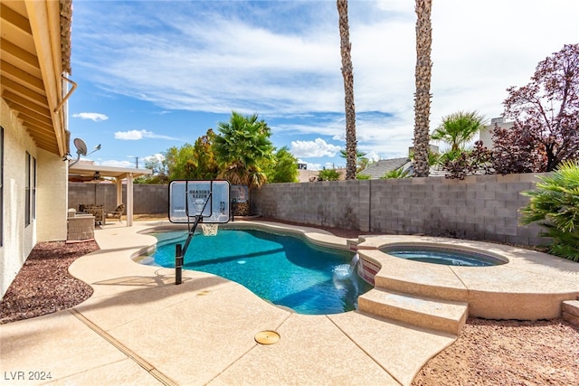 view of pool with an in ground hot tub and a patio area