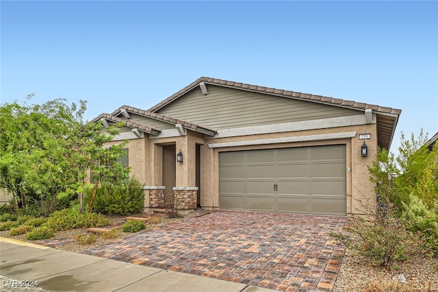 ranch-style home featuring a garage