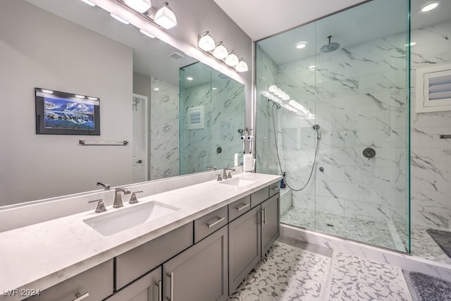 bathroom featuring vanity, tile patterned flooring, and an enclosed shower