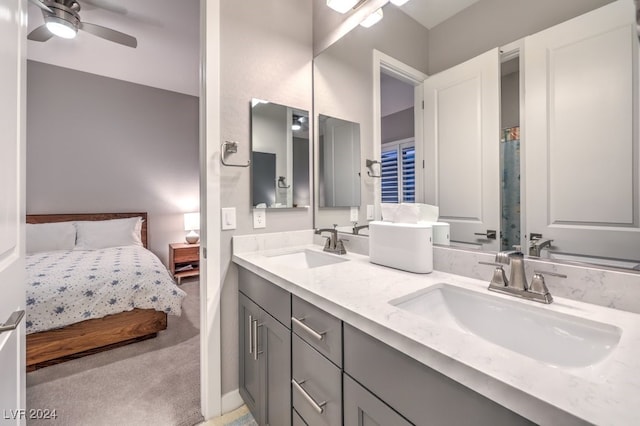 bathroom featuring ceiling fan and vanity